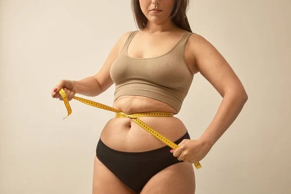 Measuring the waist as part of a wellness routine